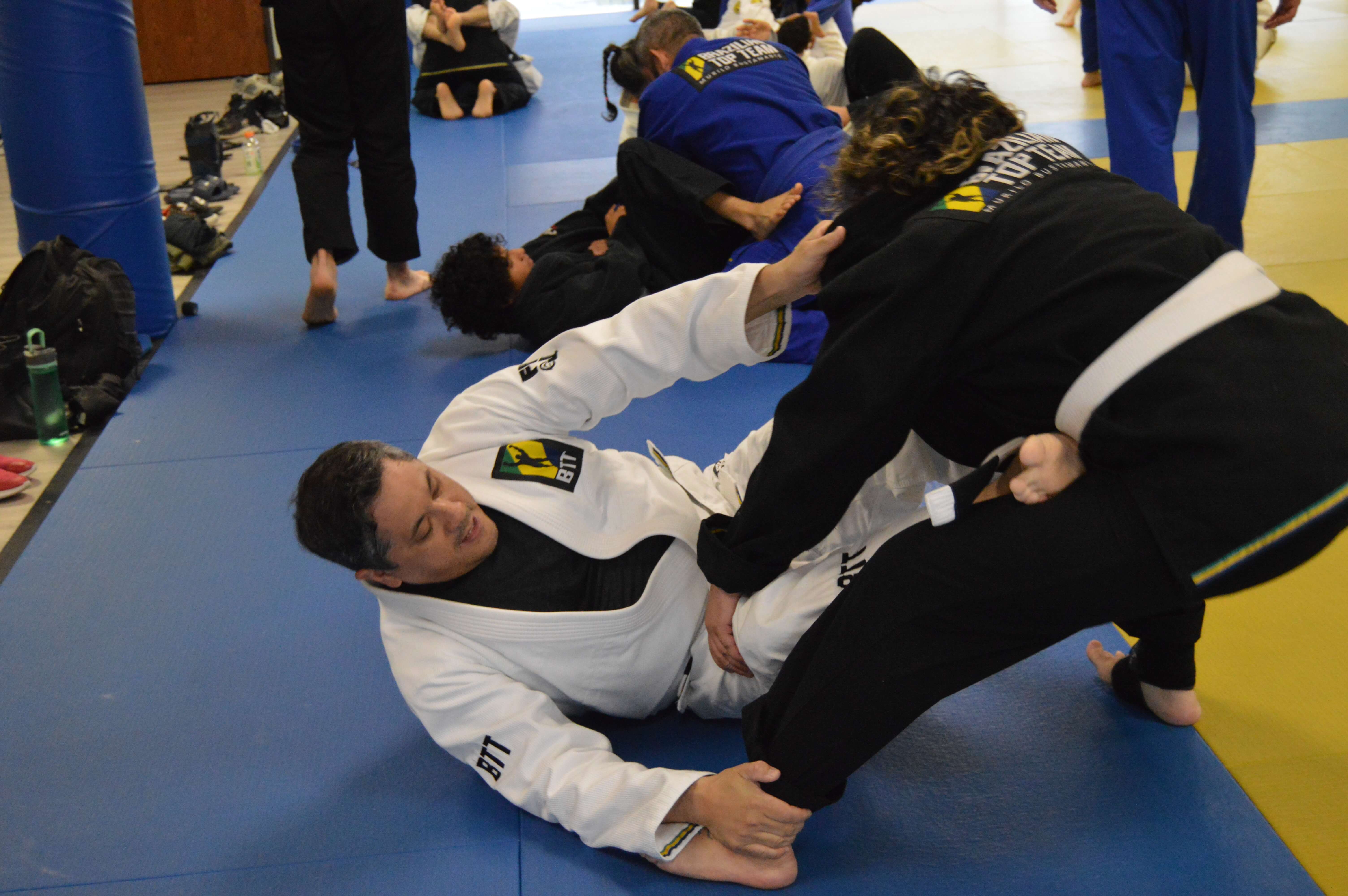 Students sparring during BJJ class